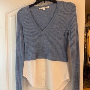 Veronica Beard light blue ribbed V-neck sweater with white shirt hem
